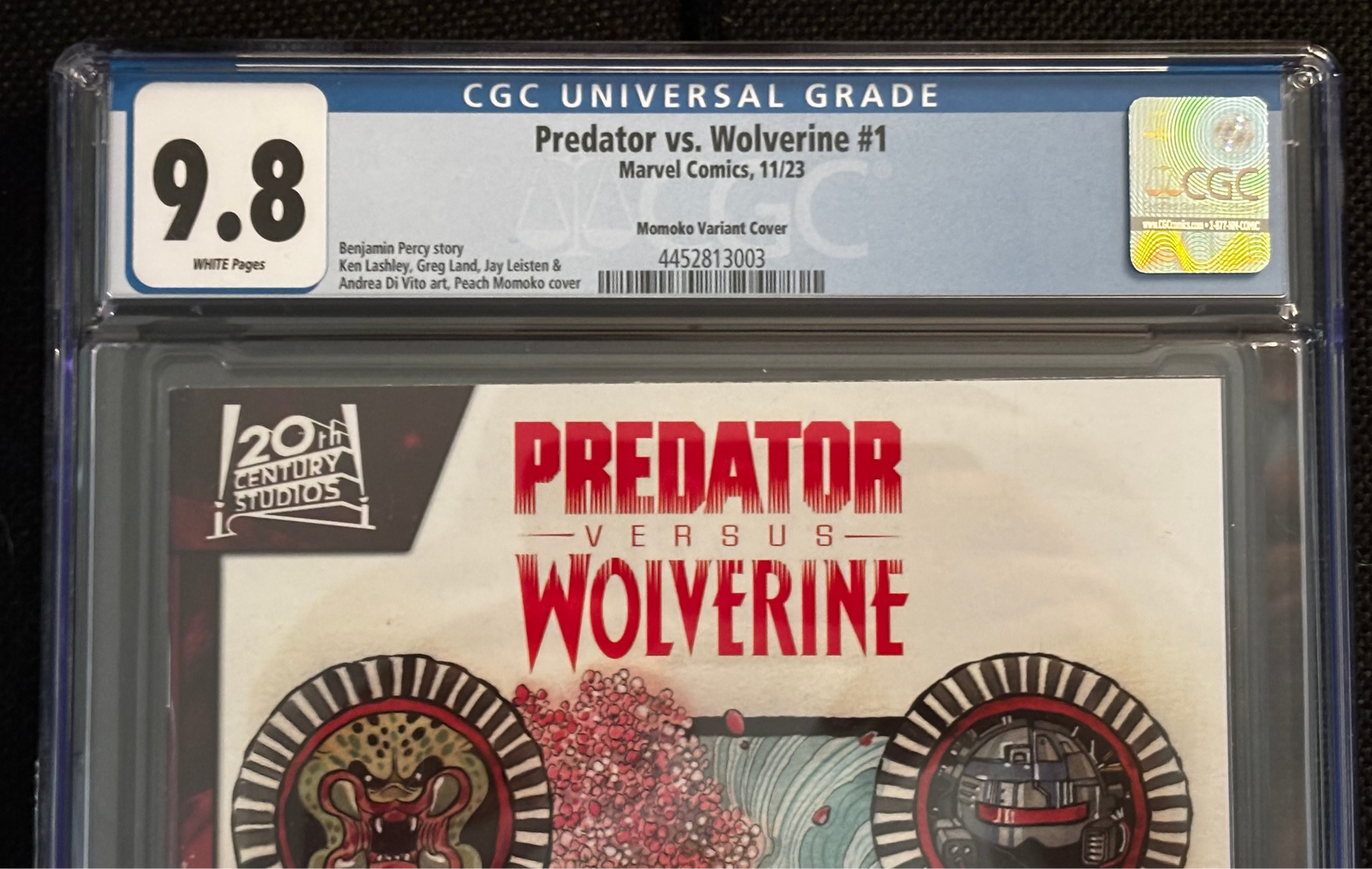 Marvel Comics 'Predator vs. Wolverine #1' comic book in CGC grading case with 9.8 rating.